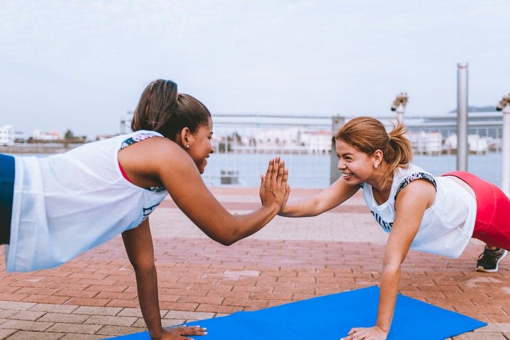 People celebrating in a Welld-powered wellness program